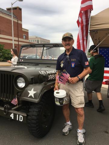 man standing in front of Jeep