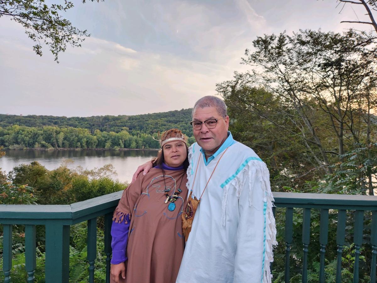 father and daughter standing together 